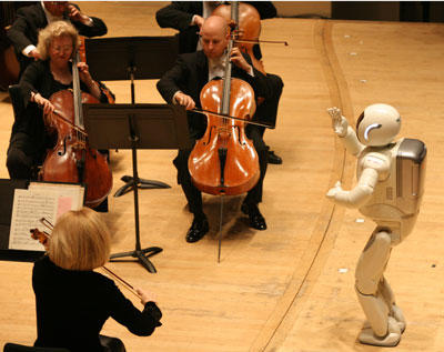 ASIMO can do more than help around the house. Here, ASIMO conducts the Detroit Symphony Orchestra.
Now that you've seen working robots in pictures, think about this: could robots take over? Learn more with our article,