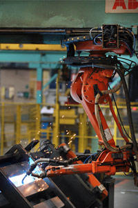 We don't mean to malign the world's hard-working industrial robots, which often perform tasks too dangerous or repetitive for the typical person. This robot arm is welding bridge components at the Mabey Bridge factory in Gloucester, England. The bridges under construction are being sent to flood-ravaged areas of Pakistan.