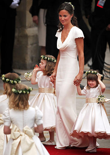 Pippa also opted to mimic Kate with a half-up hairstyle with Lily of the Valley flowers as a hairpiece.