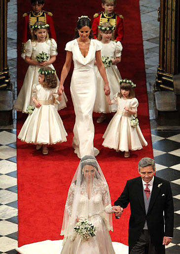 The beautiful cowl neckline became a much sought after look in bridal apparel because of this fashion-forward MOH.