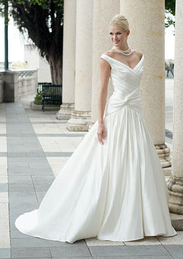 The ruched bodice and off-the-shoulder straps of this dropped-waist ball gown keep a timeless design fashion-forward.