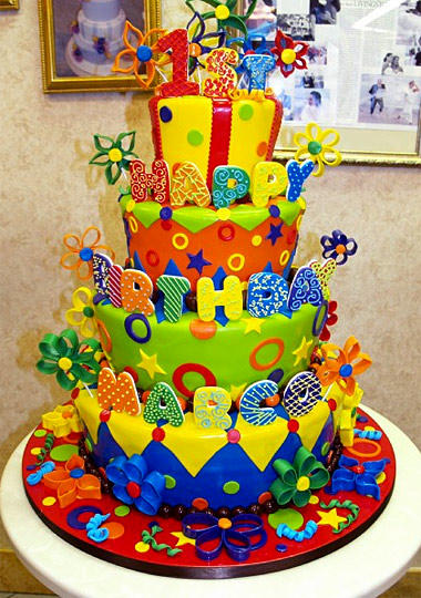 One-year-old Marco gets a four-tiered explosion of color of taste on his birthday.