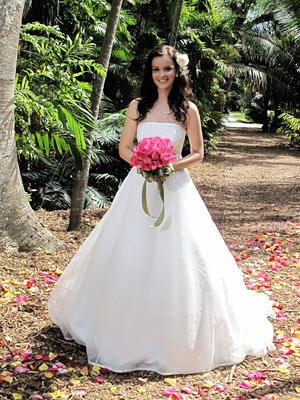This classic princess ball gown has a straight neckline and wide skirt with subtle tulle overlay.