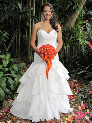 Cascading layers of ruffles and a ruched bodice give this fit and flare gown plenty of texture.