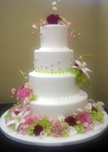 A four-tiered cake with floral details, seen at Lackawanna.