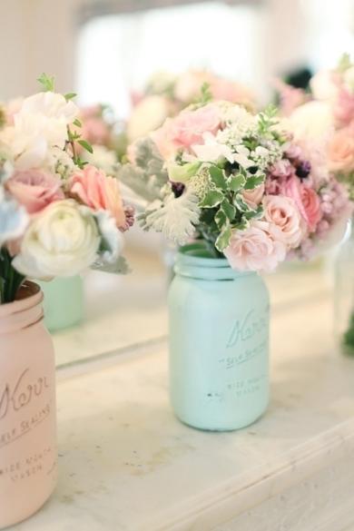 In another variation of the Mason jar vase, these are painted pretty pastels for a spring wedding.