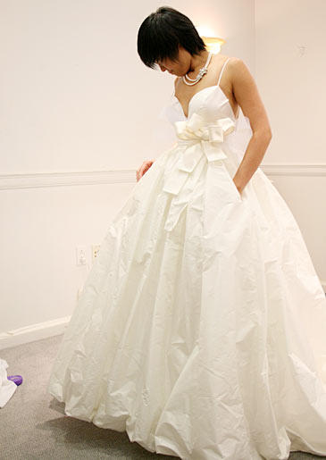 The Double Dress Bride: If you've got a budget big enough for two dresses, you definitely want those to stand apart from each other. And with one in white and another in pink, Michelle's got the right idea.