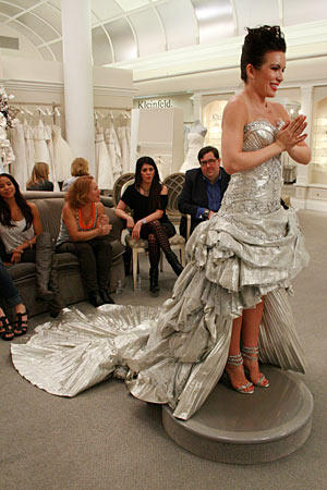 This unforgettable Pnina Tornai design doesn't come cheap (the bride here paid $34,000 for the dress), but it makes a strong statement.