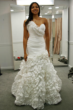 A sweetheart neckline and one-shouldered ruffle detail add Latin flavor to this sexy fit and flare gown.