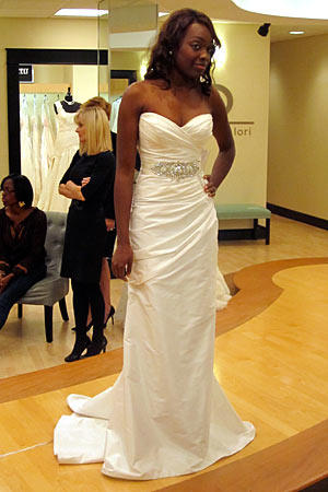 This white satin sheath with sweetheart neckline makes the bride look especially willowy.