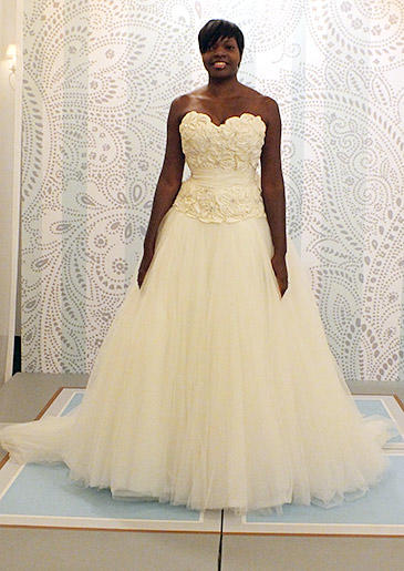 What could be more romantic for a spring or summer bride than this rosette-embellished bodice with sweetheart neckline? A dreamy tulle skirt completes the look.