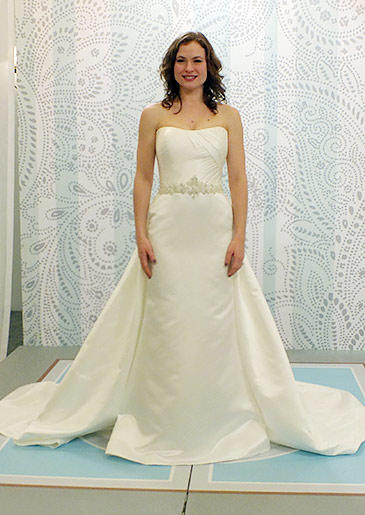This champagne sheath with straight neckline and dramatic train is the height of elegance.
