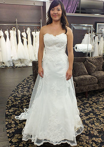 This A-line gown with lace-embroidered overlay and sweetheart neckline is well-suited for spring and summer weddings.