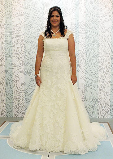 This lace ivory gown with cap sleeves looks great against olive skin.