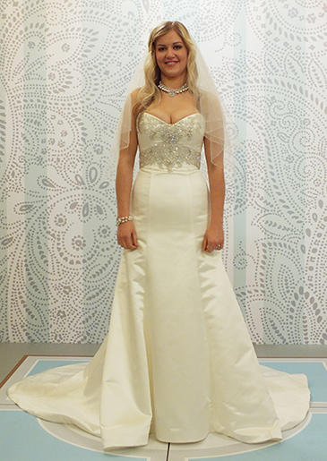 Beads that wrap the waist and frame the bust can minimize a bride's stomach and chest.
