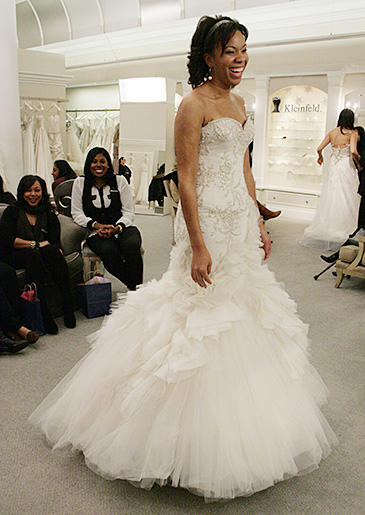 A fit and flare gown gets its drama from a full tulle skirt.