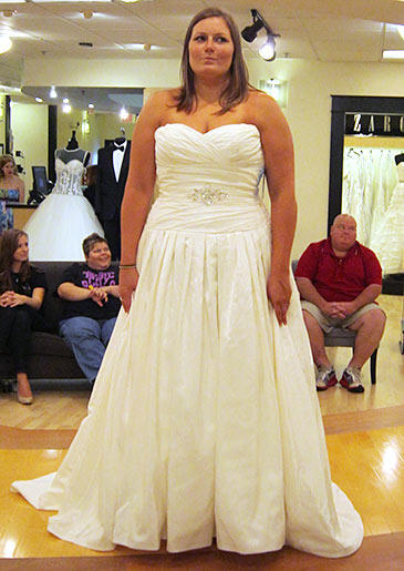 This white A-line gown works for large-busted brides because a ruched bodice offers extra support.