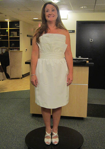 A simple short sheath in ivory is appropriate for an encore wedding or for a reception dress.