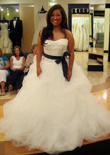 A low-cut satin bodice pairs with a big, frothy skirt to balance sexy and sweet.
