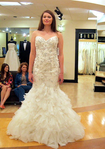 A sexy mermaid gown with ruffled skirt and silver beadwork scattered from bust to thigh make this look a complete knockout.