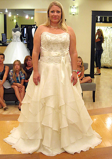 An A-line handkerchief skirt is charmingly bohemian, but silver beadwork at the bust dresses up this gown.