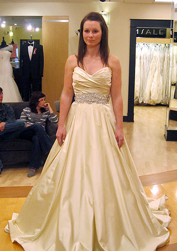 This luminous champagne ball gown has an antique quality to its color.