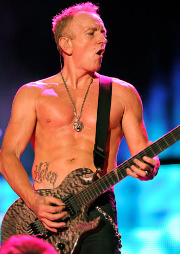 Lead guitarist in Def Leppard visits LA Ink with his fiance to get each other's name on their abdomens.