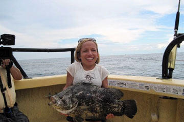 Jen holds a big one she caught while deep sea fishing off the coast of central Florida. You don't need height to reel in a fish like that, just muscle and determination.
