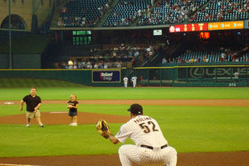 Bill and Jen work together to throw out the first pitch at a Houston Astros vs. Kansas City Royals baseball game. The little couple has made Houston their new home and definitely been greeted with open arms and catcher's mitt!