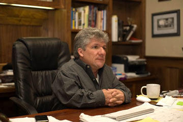 Join us for a look at life on Roloff Farms in Oregon. Here, dad Matt Roloff sits at his desk in the family home. He's got many unique ideas for attracting visitors to the farm, but the best is the pumpkin patch every fall.