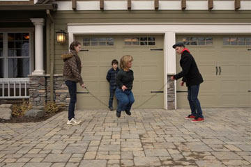 Amy Roloff jumps rope in the driveway with the help of her kids Molly, Jeremy and Jacob. The family would fall apart without Amy's caring and watchful eye making sure her kids, and especially her husband, are behaving themselves.