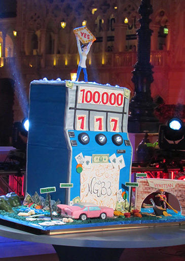 Gretel-Ann's cake impressed the judges with its detailed story of her life, but they weren't keen on the slot machine shape or the misspelling of the hotel's name. Gretel-Ann was eliminated in the very final challenge but was a fierce competitor!