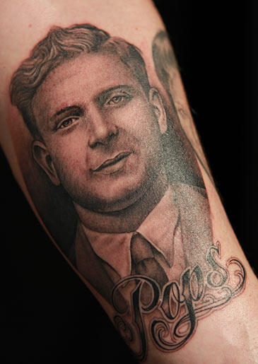 Tim tattoos a portrait of John's father to memorialize his burger joint named after his "Pops."