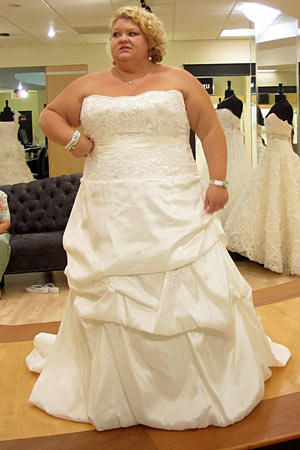 Christy wears 2 Be Bride Style Sabrina.
Fabric: memory taffeta/beaded lace
Description: lace bodice with bubble pickup skirt
Color: white
Price: $$
