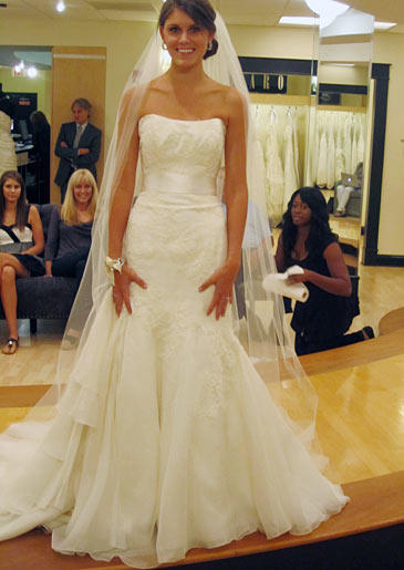 Kaci wears Marisa Style 895.Fabric: silk organza/Alencon laceDescription: lace down one side of bodiceColor: ivoryPrice: $$