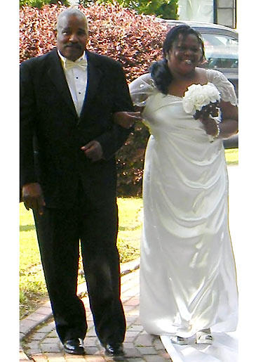 Penny Freeman walks down the aisle on her wedding day.