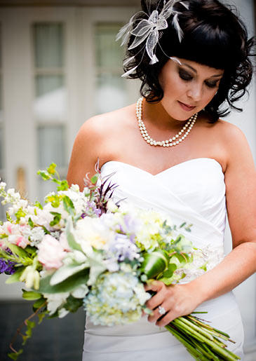 Tracy poses with her bridal bouquet.