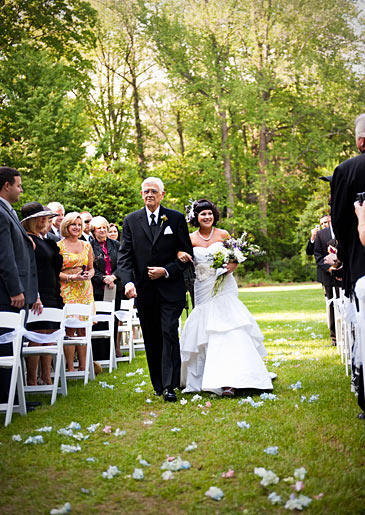 Tracy's grandfather walks her down the aisle on her wedding day.