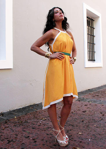 Stacy's look here features a deep yellow that brings out her summer glow. The green belt adds a burst of fun color that pulls together white and yellow, the optimum summer duo.