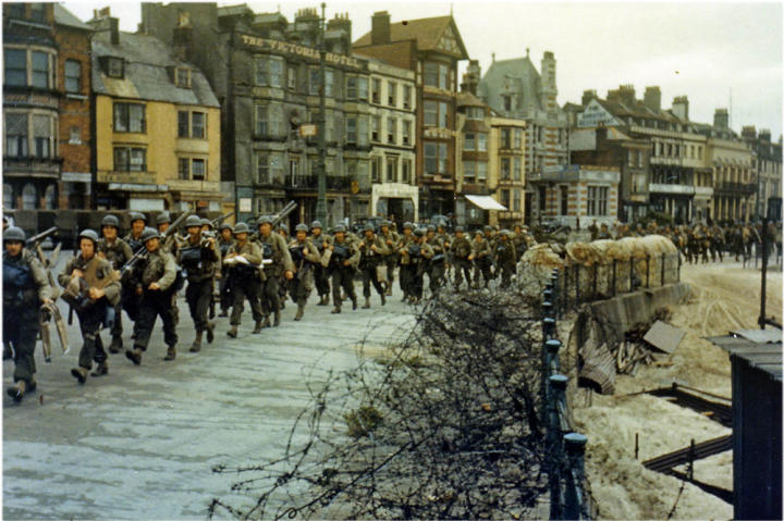 American troops marching through the streets of Weymouth on their way to the docks where they will be loaded into landing craft for the big assault.