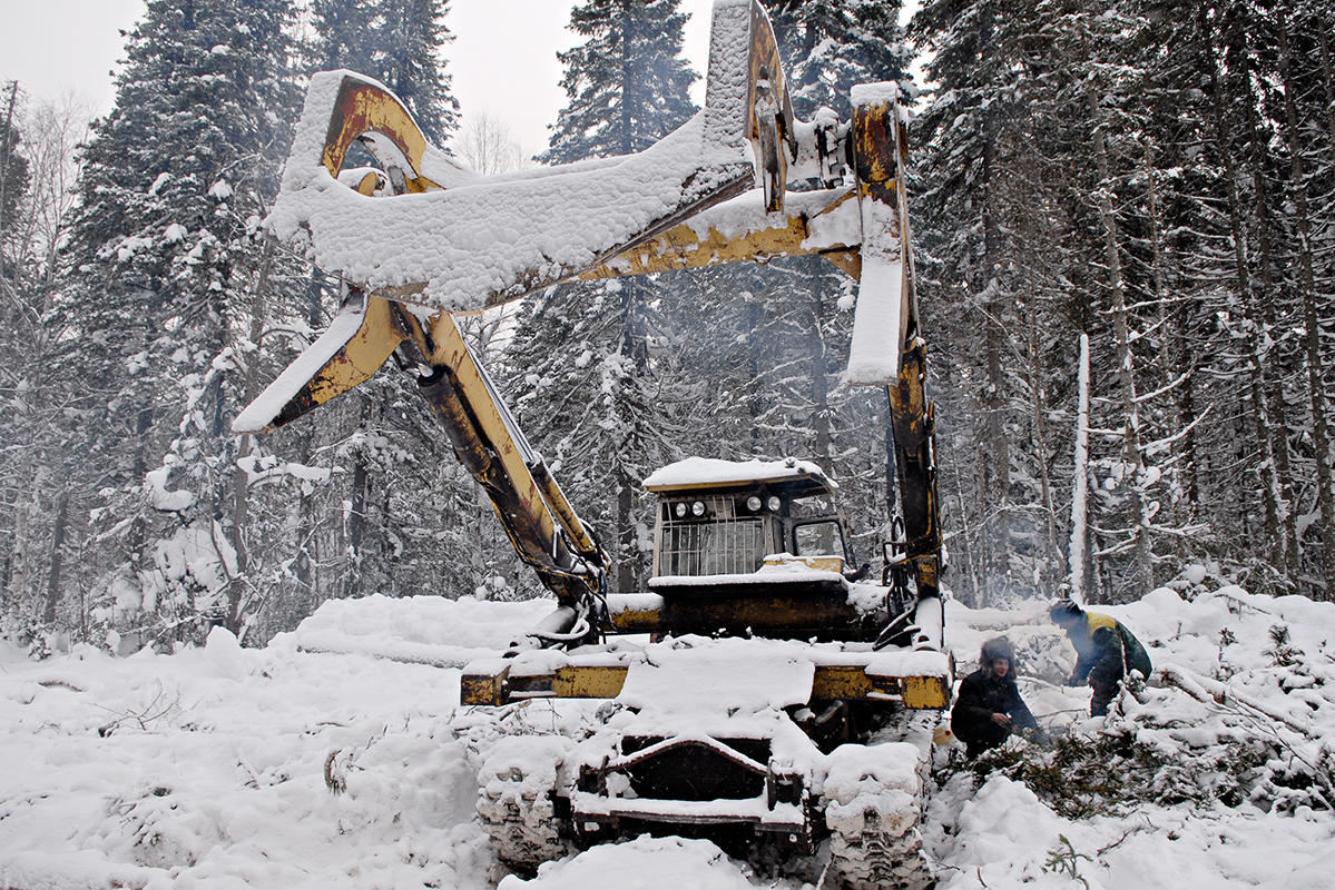 A Russian log loader in the snow.