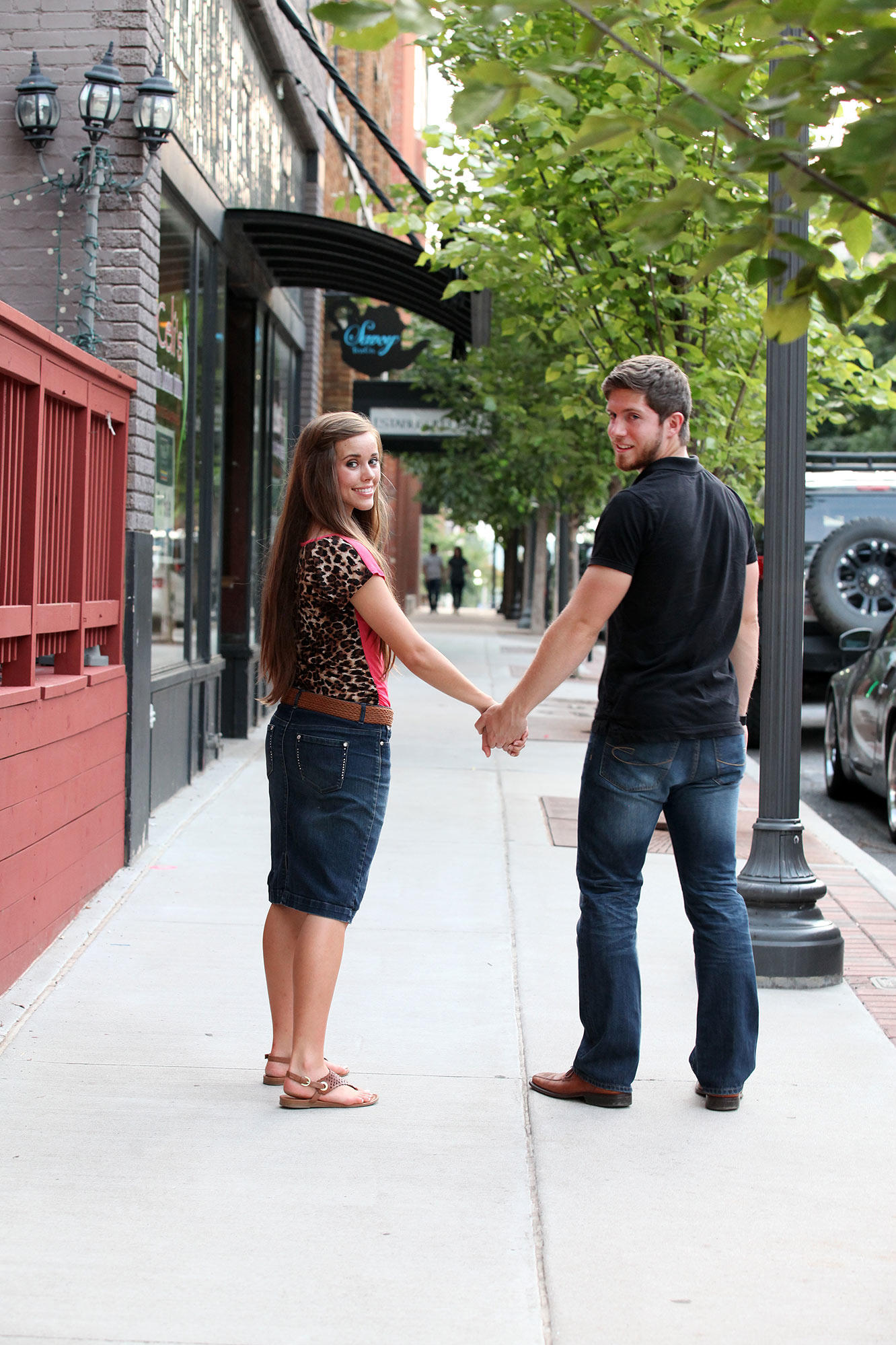 Now that they're engaged, they can finally hold hands! Get the lowdown on