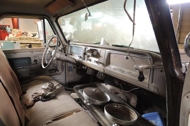 A view of the Chevy pickup interior through the driver's side door.