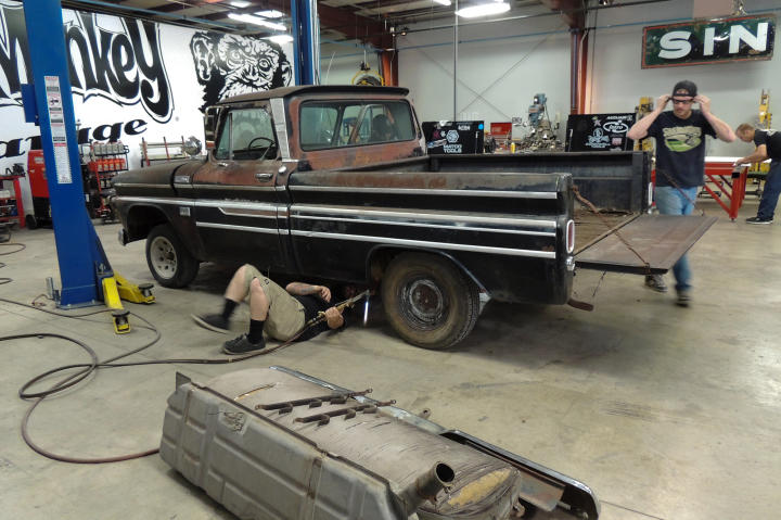 Keenan, Hons and Dustin DeLeon work on the 1965 Chevy C-10 pickup truck.
