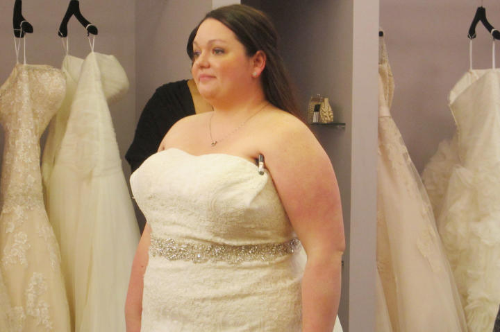 Christen evaluates the strapless neckline on this dress.