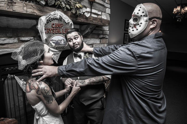 Angi and Matt had a Friday the 13th wedding. They fill the evening with all things that go bump in the night. Here Jason (as in Freddy vs. Jason) gave the couple a deadly scare.
