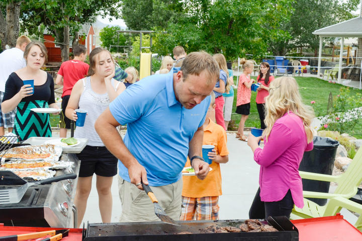Brady tackles a big job - grill master for his family BBQ.