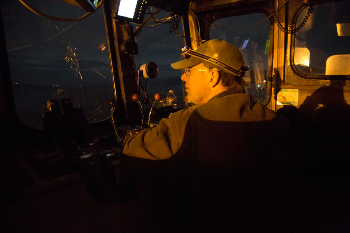 Otto Kilcher drives the barge to Pearl Island.