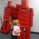 While her husband has the shooting skills, Jen takes a self defense class with Rice University police sergeant Jim Baylor. Jen practices warding off an attacker.