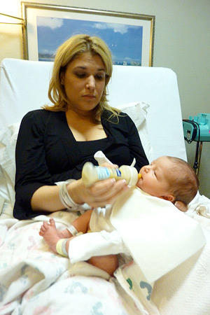 Mommy time! Lisa gives baby Carlo one of his first bottles.